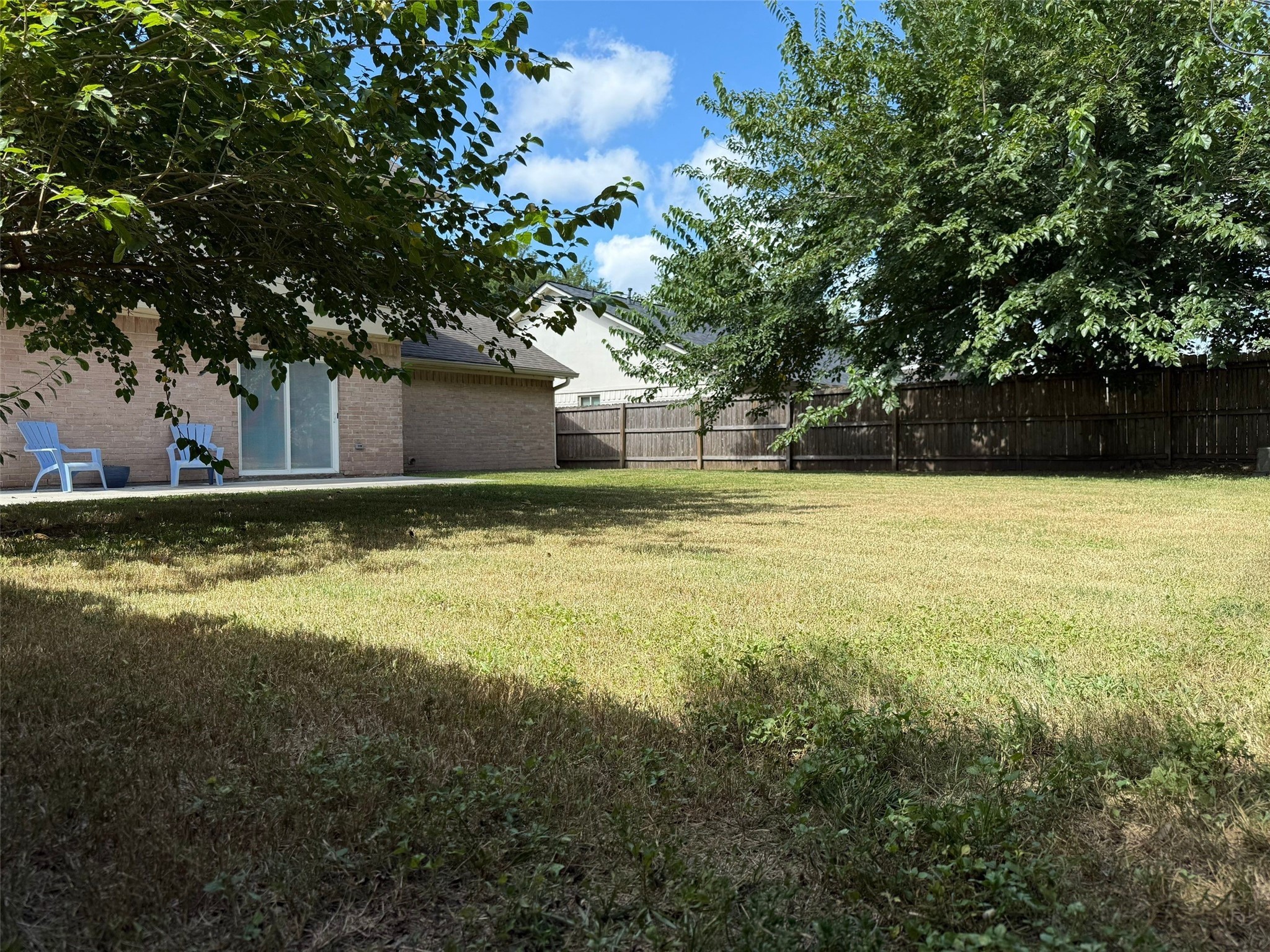 9626 Magnolia Ridge Drive Houston, TX 77070 - Photo 36 of 40 a view of a swimming pool with an outdoor space and seating area