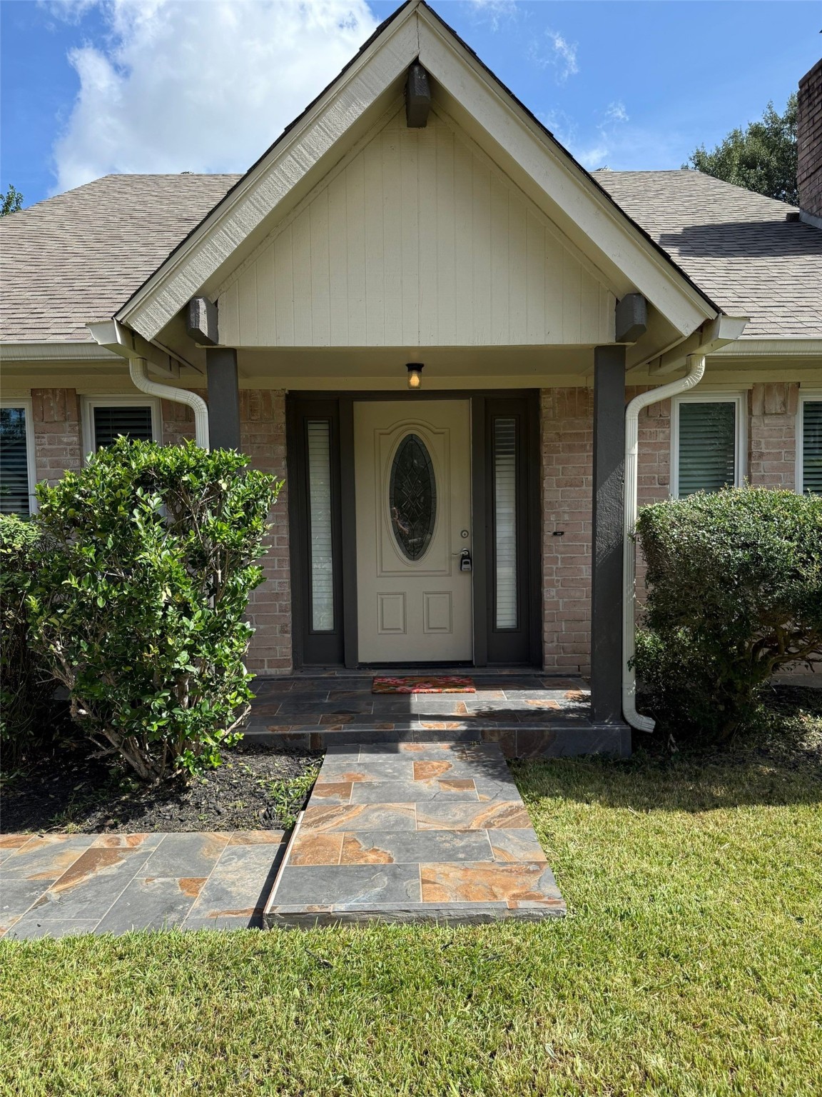 9626 Magnolia Ridge Drive Houston, TX 77070 - Photo 4 of 40 a front view of a house with garden