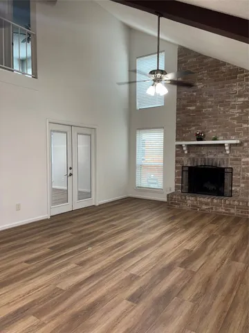 wooden floor fireplace and natural light