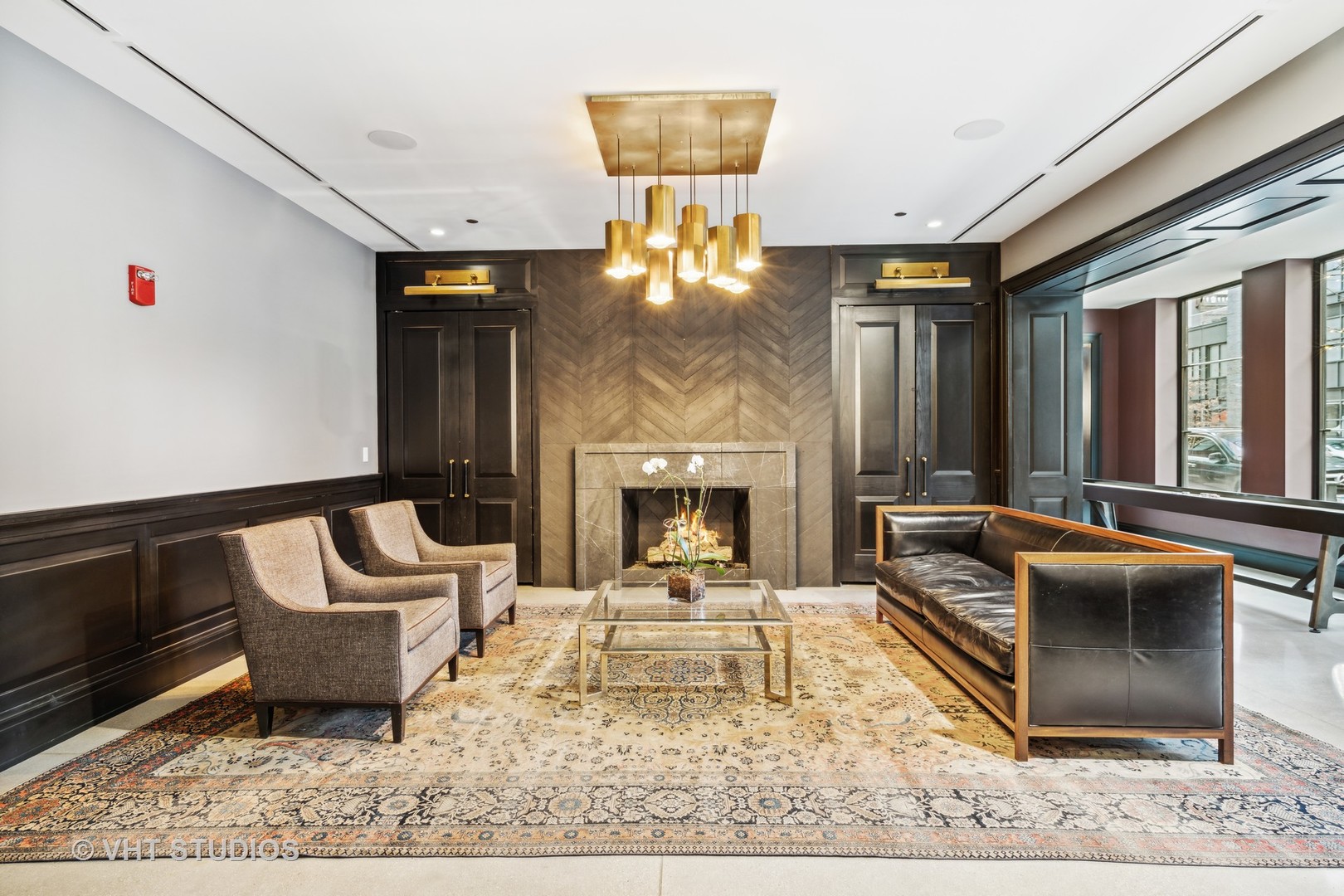 1109 West Washington Boulevard, Unit 4B Chicago, IL 60607 - Photo 4 of 6 a living room with furniture and a fireplace