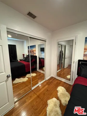 a bedroom with a bed and walk in closet