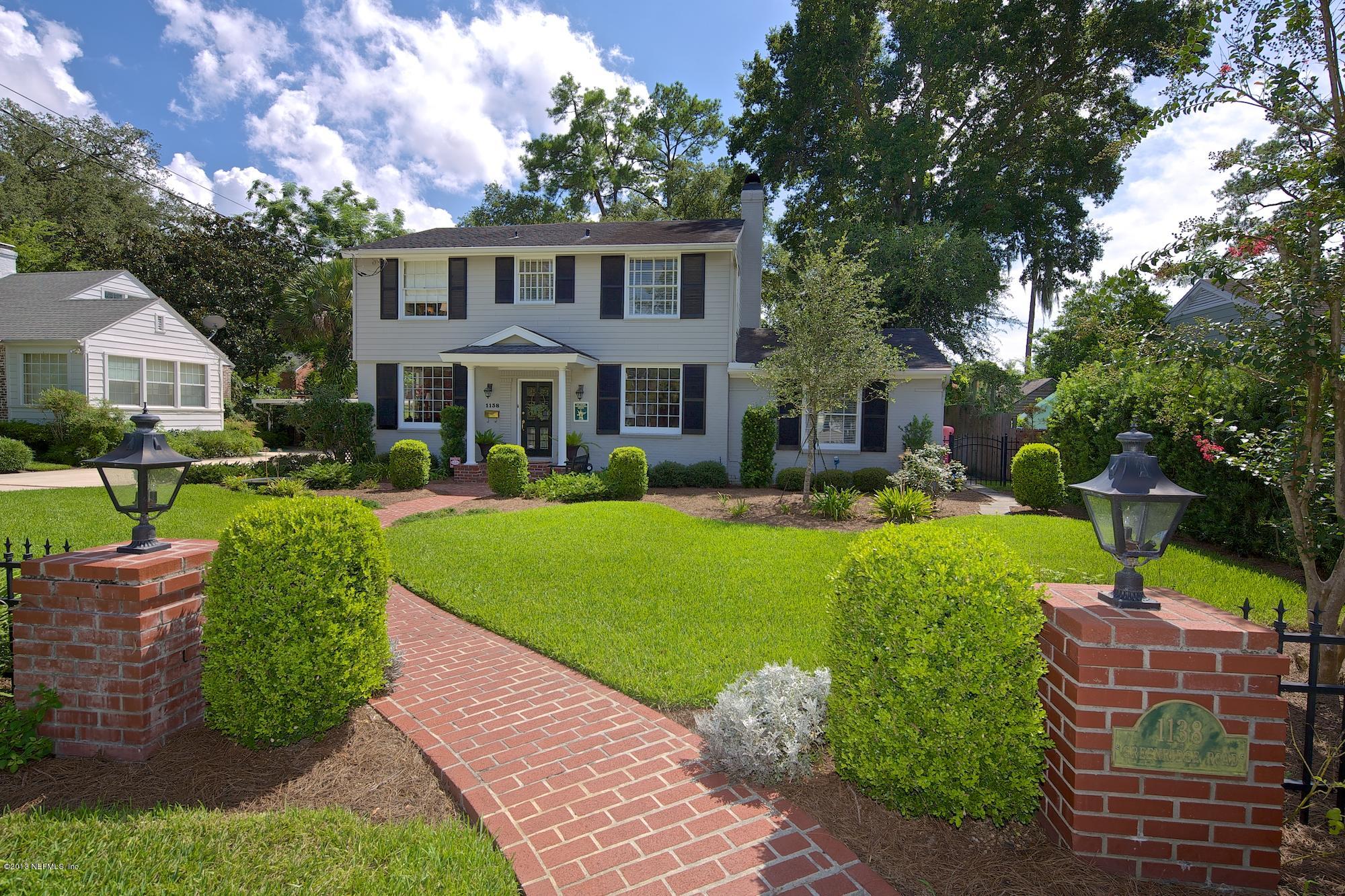 1138 Greenridge Road Jacksonville, FL 32207 - Photo 1 of 36 a front view of a house with garden