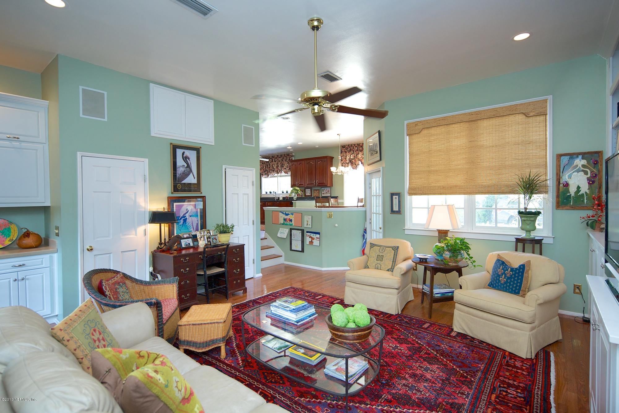 1138 Greenridge Road Jacksonville, FL 32207 - Photo 15 of 36 a living room with furniture dining table and a large window