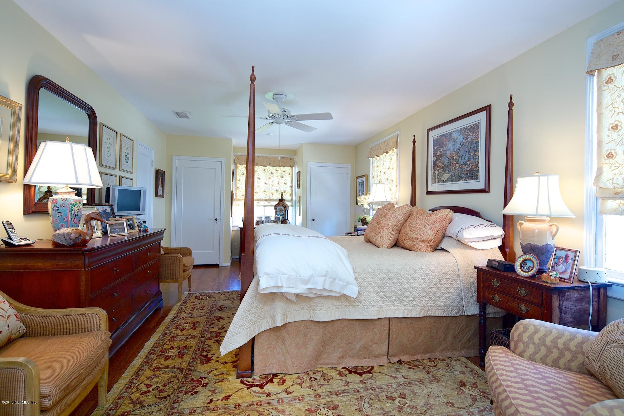 1138 Greenridge Road Jacksonville, FL 32207 - Photo 20 of 36 a bed room with furniture and a window