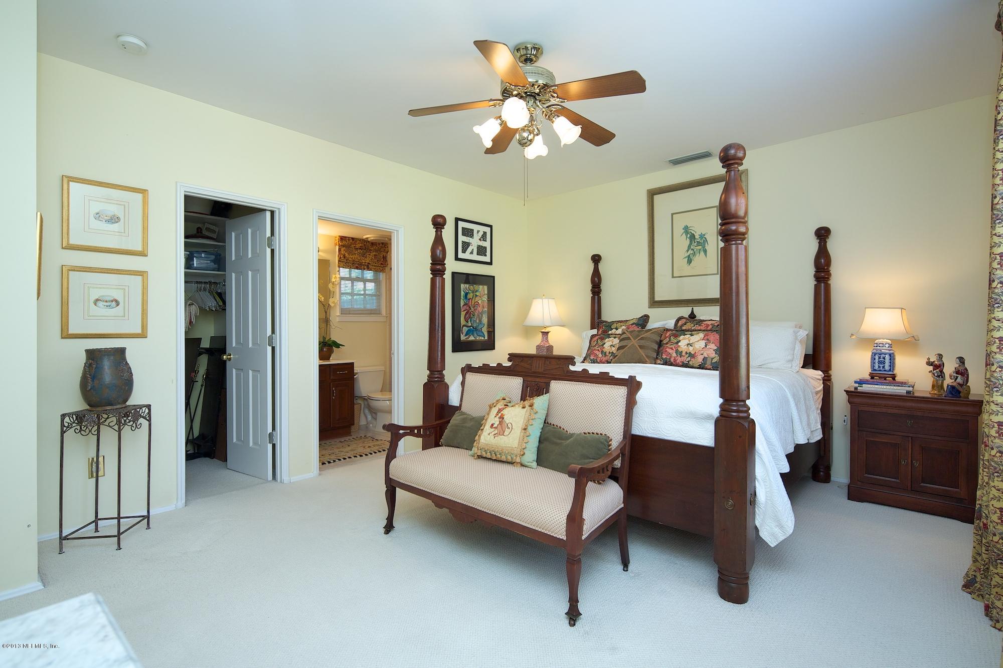 1138 Greenridge Road Jacksonville, FL 32207 - Photo 29 of 36 a living room with furniture and a chandelier