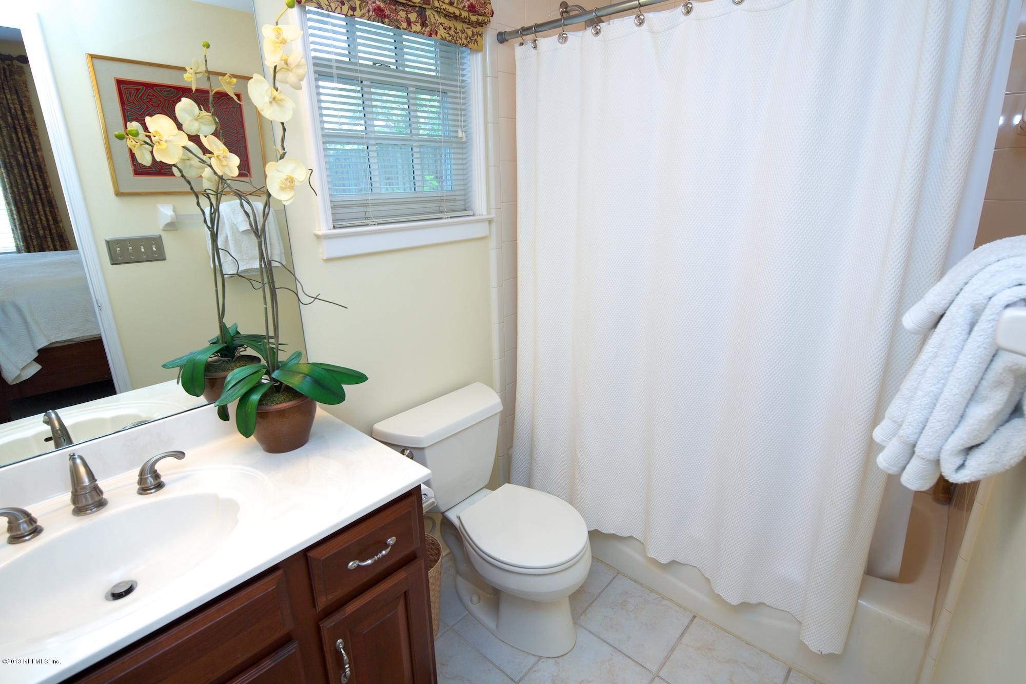 1138 Greenridge Road Jacksonville, FL 32207 - Photo 30 of 36 a bathroom with a sink toilet and mirror