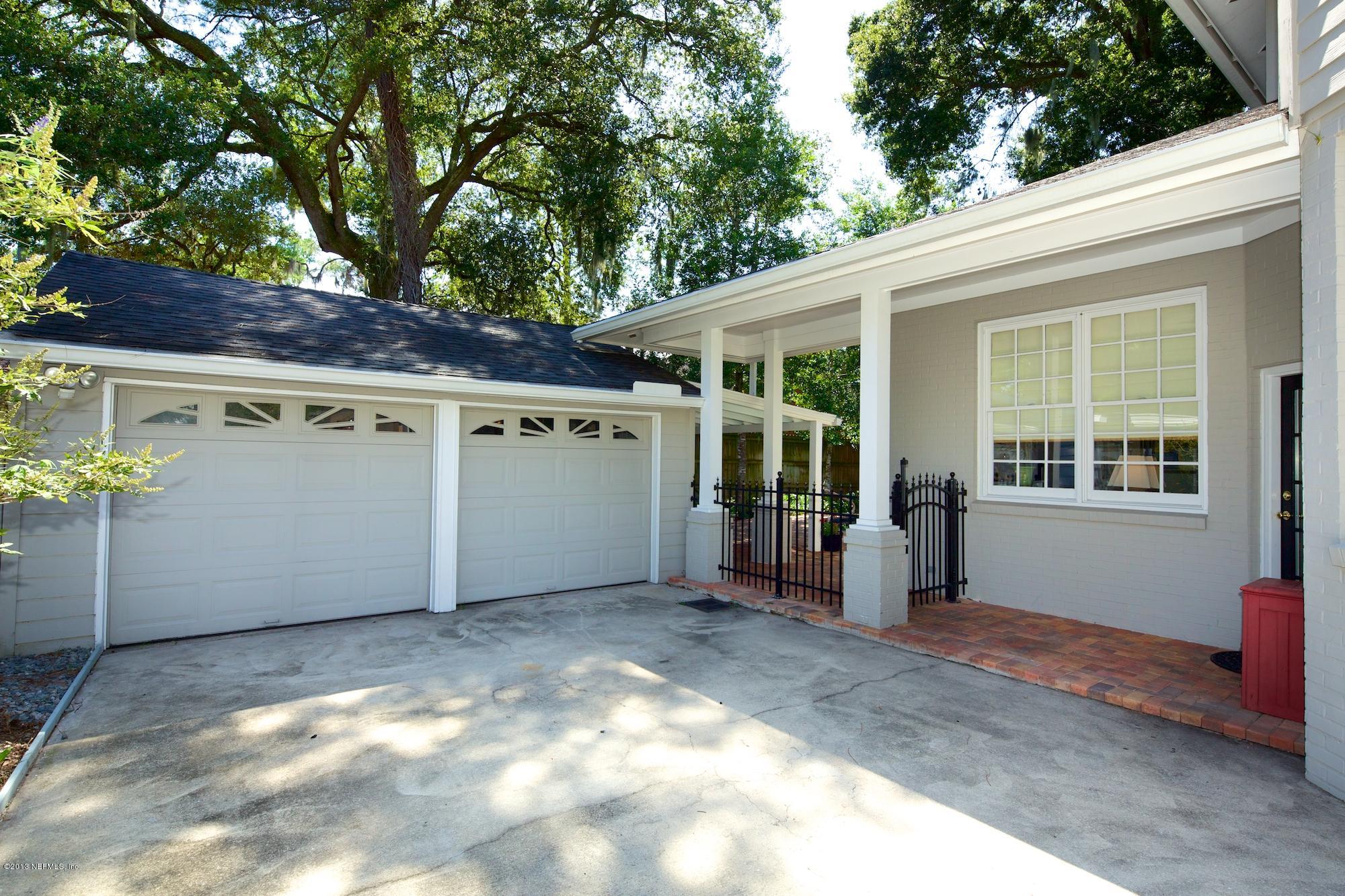 1138 Greenridge Road Jacksonville, FL 32207 - Photo 36 of 36 a view of a backyard with a large tree