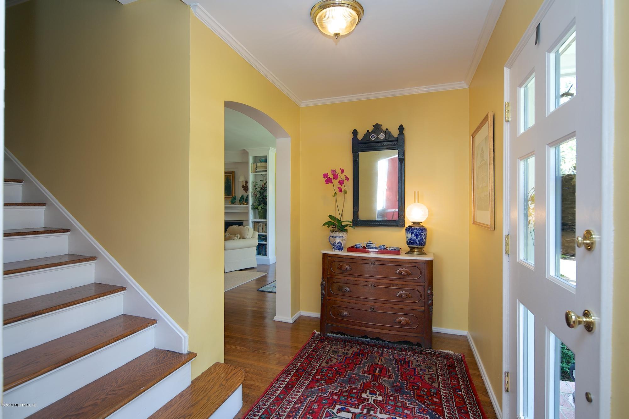 1138 Greenridge Road Jacksonville, FL 32207 - Photo 5 of 36 a room with a baby crib and dresser