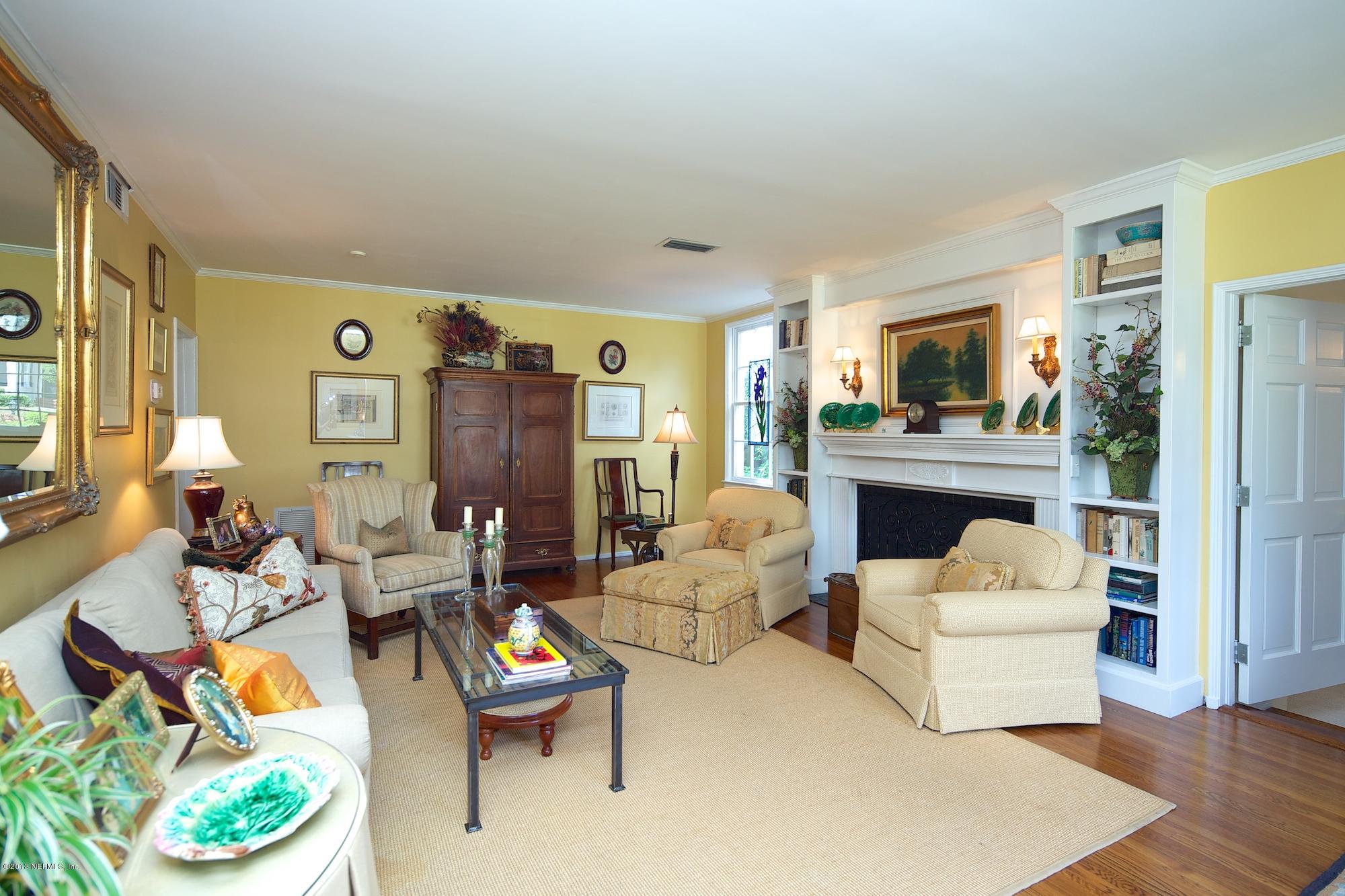 1138 Greenridge Road Jacksonville, FL 32207 - Photo 6 of 36 a living room with fireplace furniture and a wooden floor