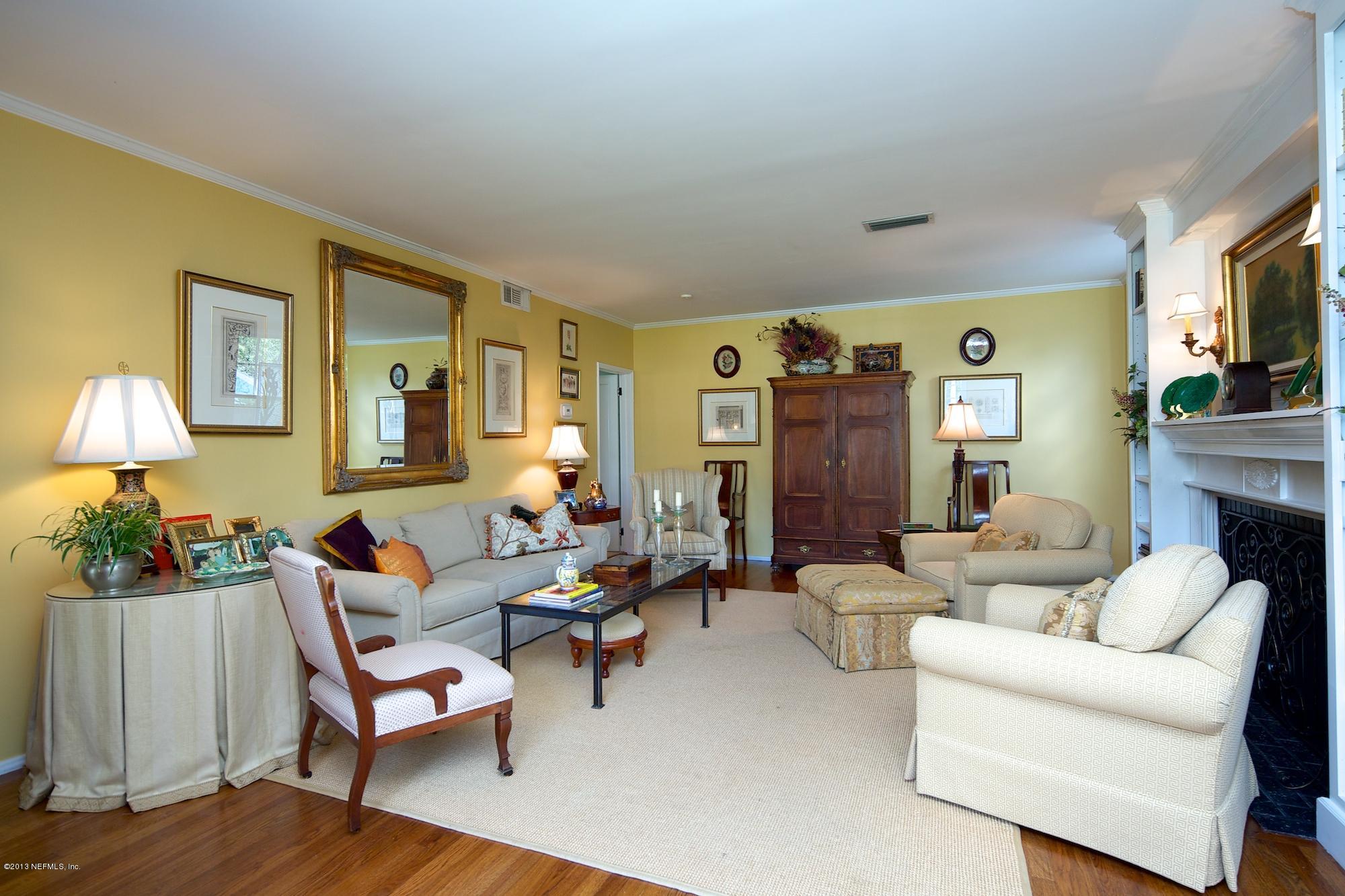 1138 Greenridge Road Jacksonville, FL 32207 - Photo 8 of 36 a living room with fireplace furniture and a lamp