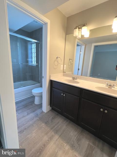 4114 3rd Street, Unit 2 North Beach, MD 20714 - Photo 19 of 24 a bathroom with a sink vanity and a toilet