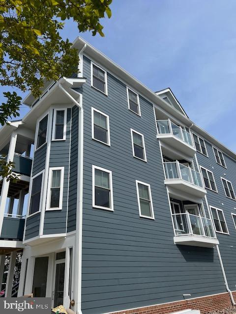 4114 3rd Street, Unit 2 North Beach, MD 20714 - Photo 2 of 24 a front view of a house with glass windows