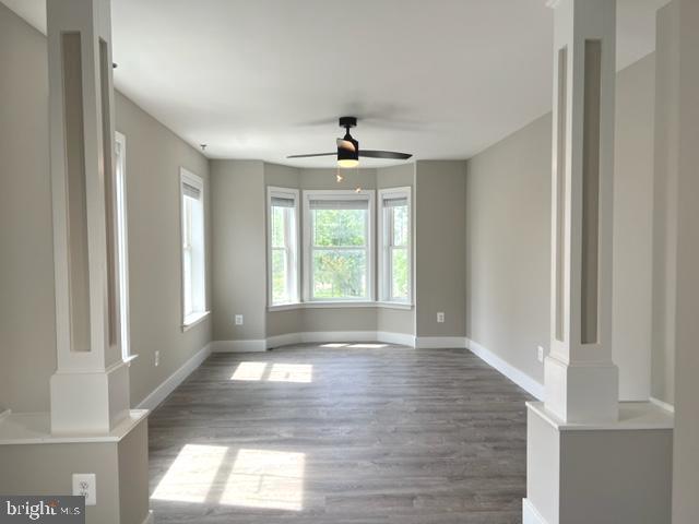 4114 3rd Street, Unit 2 North Beach, MD 20714 - Photo 4 of 24 a view of an empty room with wooden floor and a window