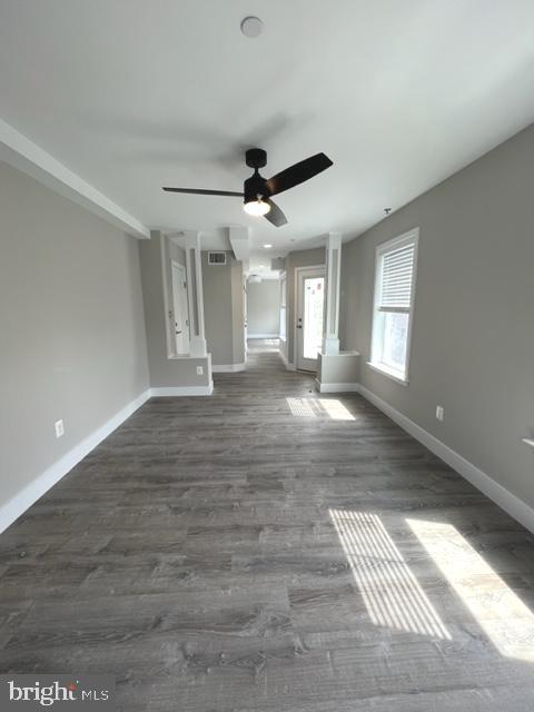 4114 3rd Street, Unit 2 North Beach, MD 20714 - Photo 8 of 24 wooden floor in an empty room with a window