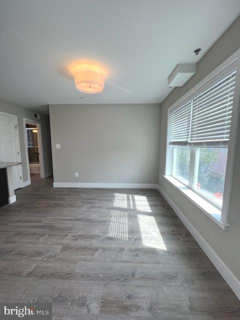 4114 3rd Street, Unit 2 North Beach, MD 20714 - Photo 10 of 24 an empty room with wooden floor and windows