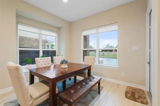 a kitchen with stainless steel appliances granite countertop a kitchen island a stove and a refrigerator