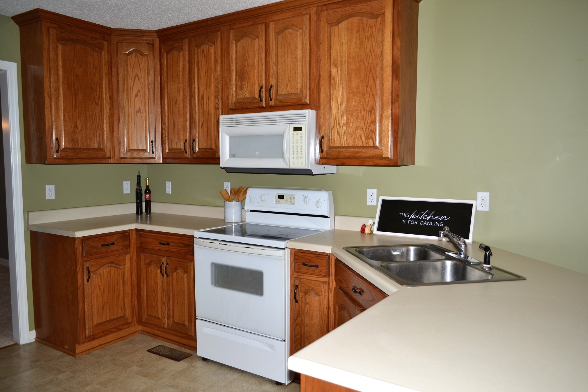 80 Eastridge Road Fayetteville, TN 37334 - Photo 12 of 43 a kitchen with a sink stove top oven and cabinets