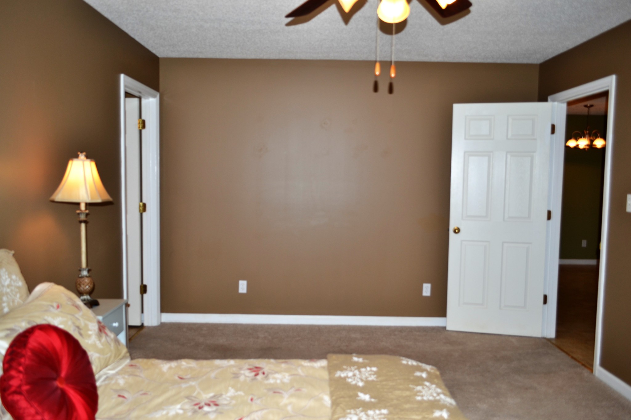 80 Eastridge Road Fayetteville, TN 37334 - Photo 24 of 43 a view of a bedroom with a bed and a chandelier