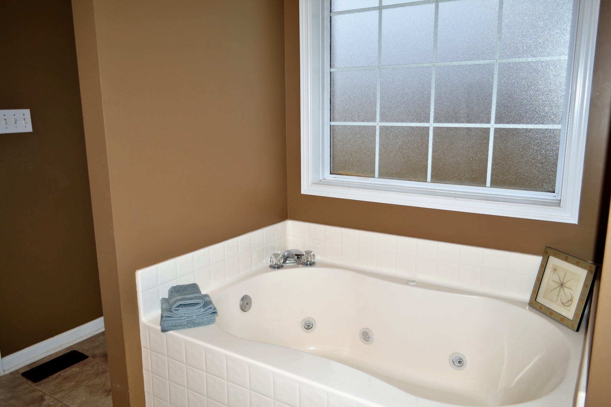 80 Eastridge Road Fayetteville, TN 37334 - Photo 27 of 43 a white bath tub sitting next to a window