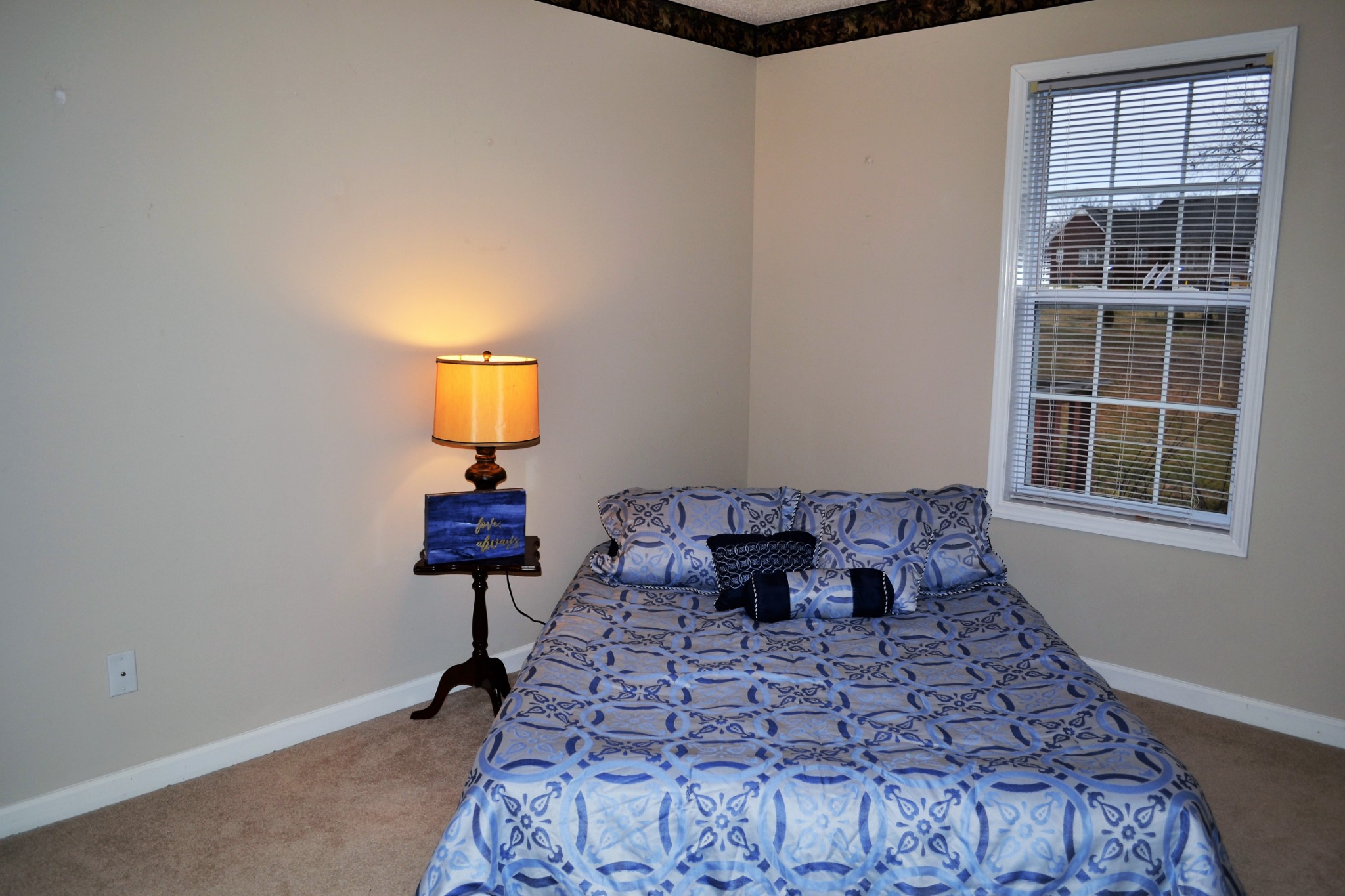 80 Eastridge Road Fayetteville, TN 37334 - Photo 30 of 43 a bed sitting in a bedroom next to a window