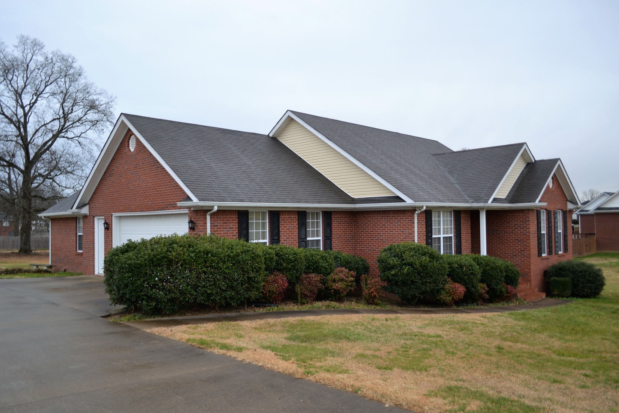 80 Eastridge Road Fayetteville, TN 37334 - Photo 4 of 43 a front view of a house with a yard and garage