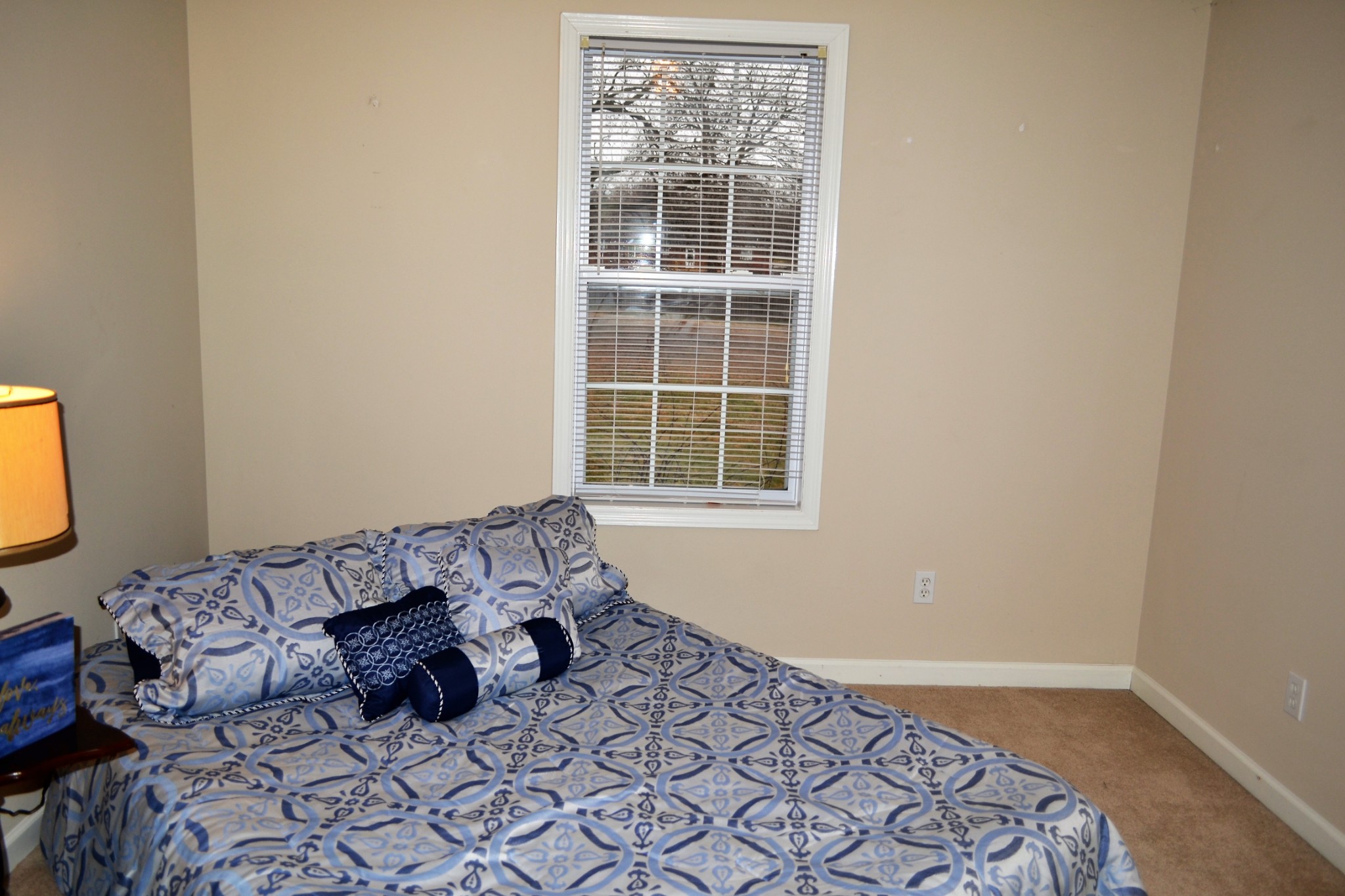 80 Eastridge Road Fayetteville, TN 37334 - Photo 31 of 43 a bed sitting in a bedroom next to a window
