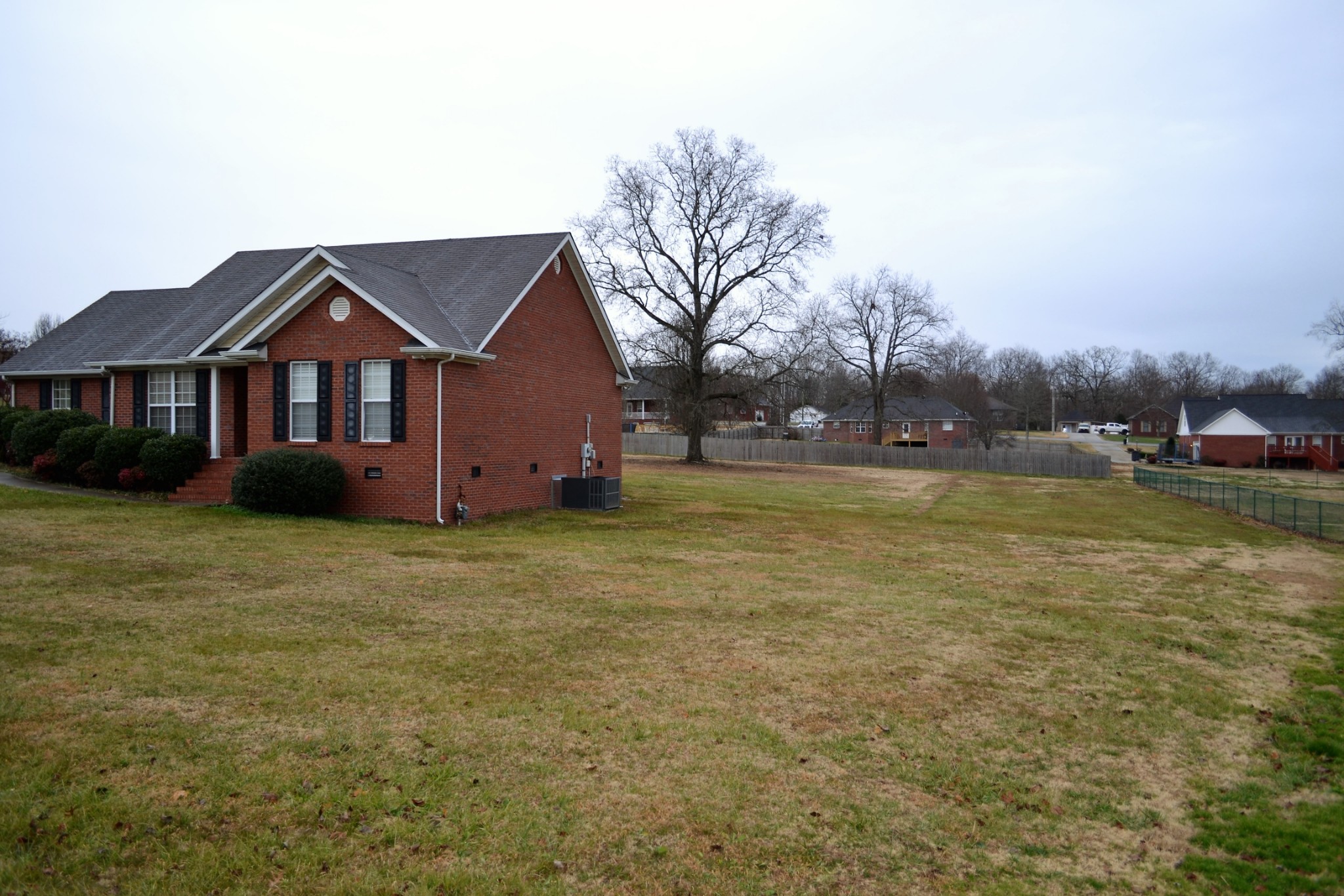 80 Eastridge Road Fayetteville, TN 37334 - Photo 42 of 43 a front view of a house with a yard and garage