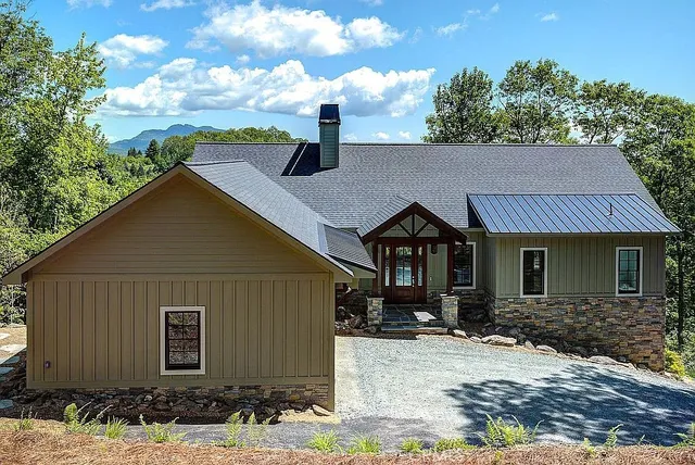 a front view of a house with a yard