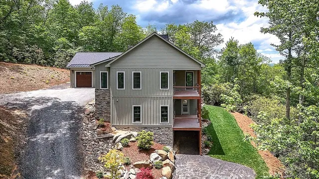 a front view of a house with garden