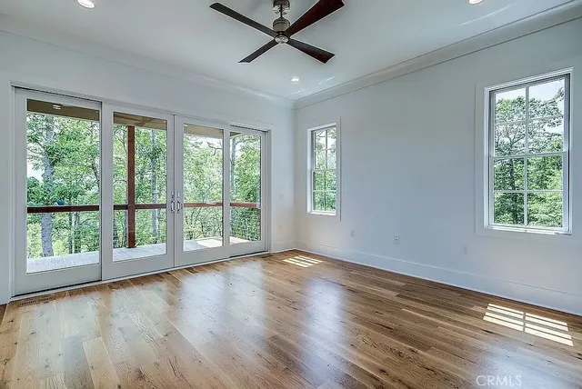 a bathroom with a granite countertop toilet a sink and a bathtub
