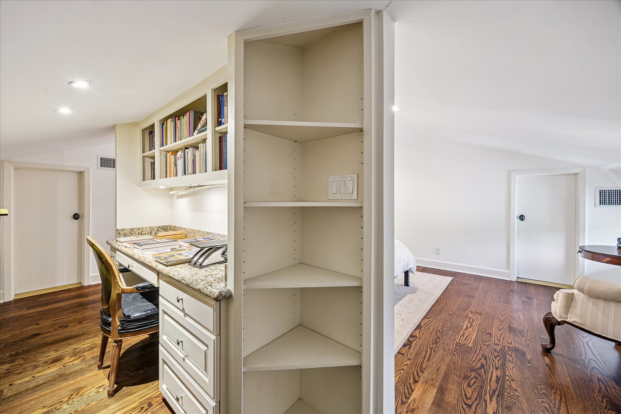 2368 Timber Lane Houston, TX 77027 - Photo 40 of 46 Thoughtfully tucked away for added privacy, the study nook features a built-in desk area, custom bookshelves, and integrated storage drawers, creating a functional yet inviting space for work, reading, or quiet retreat.