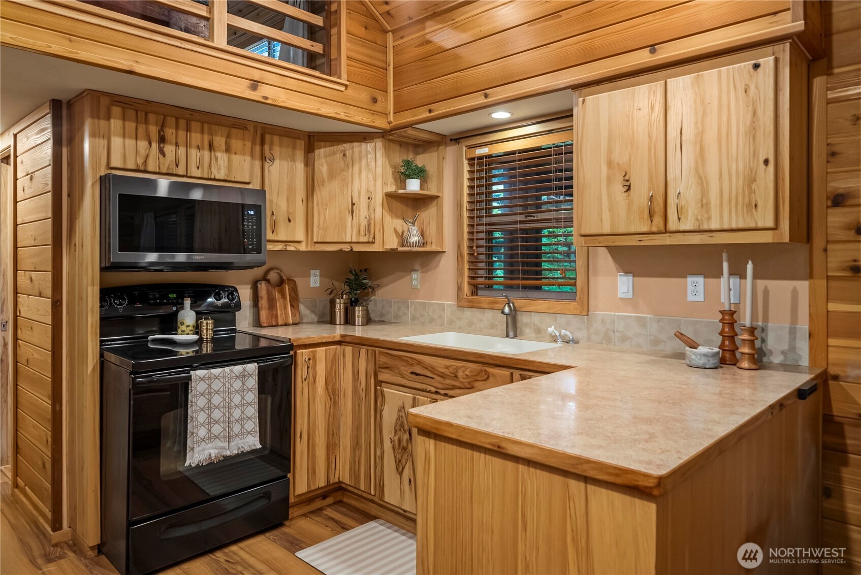 1546 Reservation Road Southeast, Unit 149 Olympia, WA 98513 - Photo 6 of 38 a kitchen with stainless steel appliances granite countertop a sink stove and cabinets