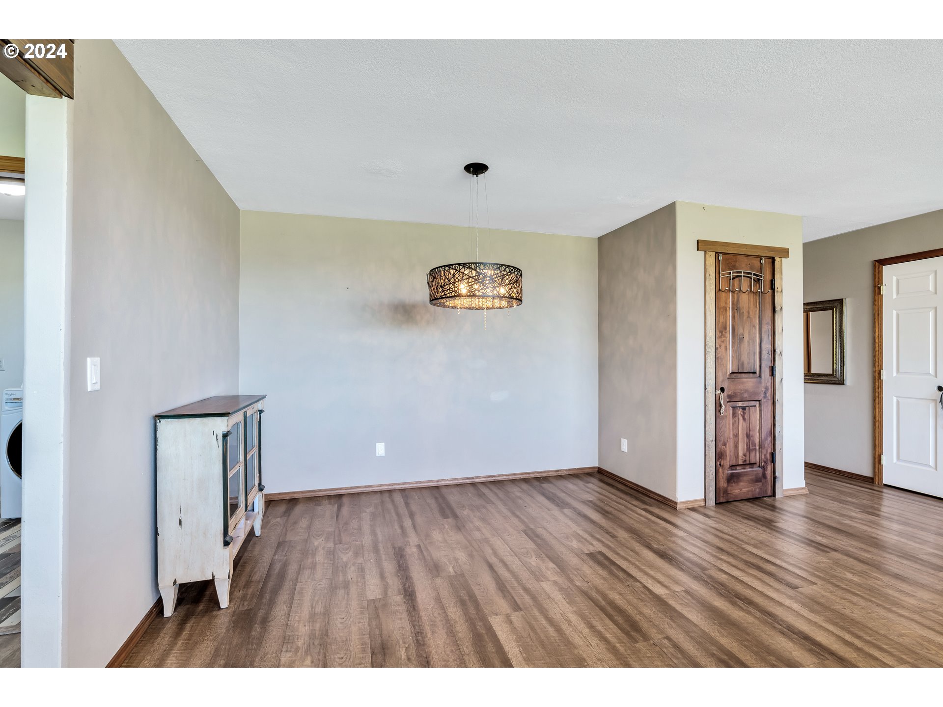 26400 Northeast 29th Avenue Ridgefield, WA 98642 - Photo 13 of 48 a view of an empty room with wooden floor