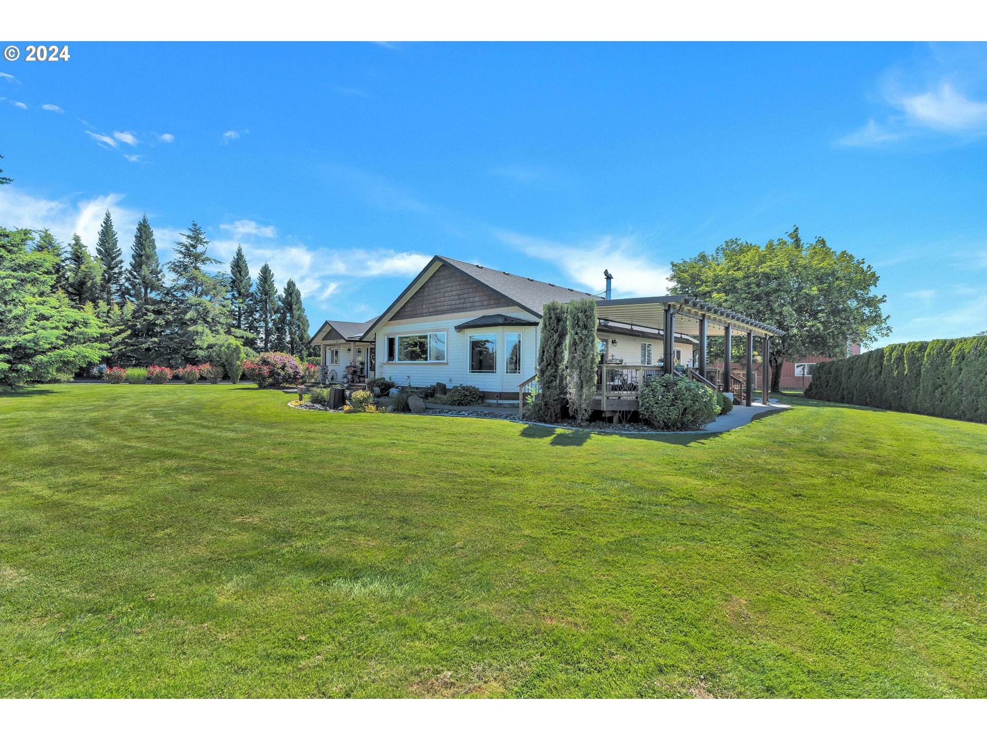 26400 Northeast 29th Avenue Ridgefield, WA 98642 - Photo 2 of 48 a view of an house with backyard space and garden