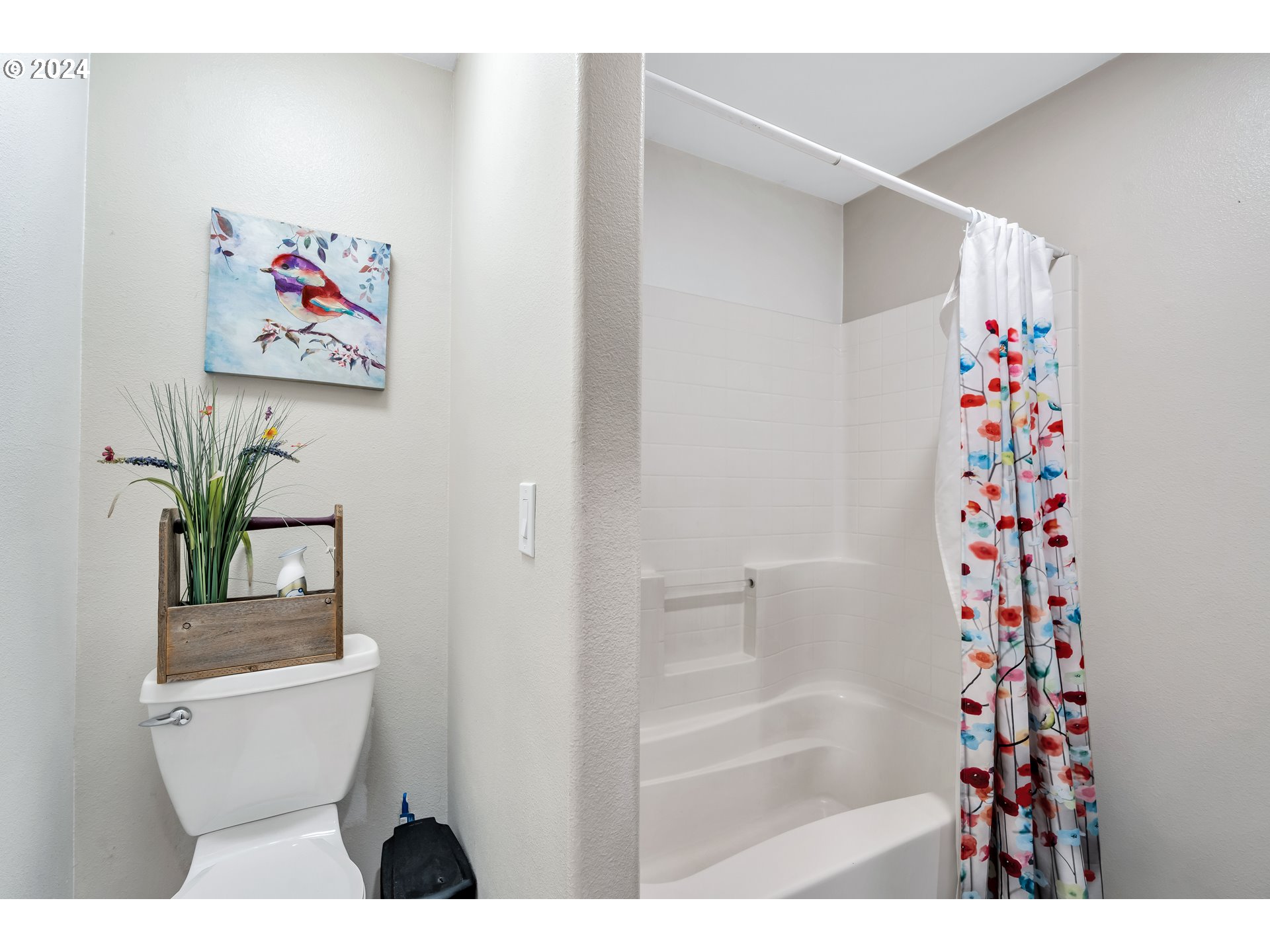 26400 Northeast 29th Avenue Ridgefield, WA 98642 - Photo 28 of 48 a bathroom with a shower curtain and a toilet