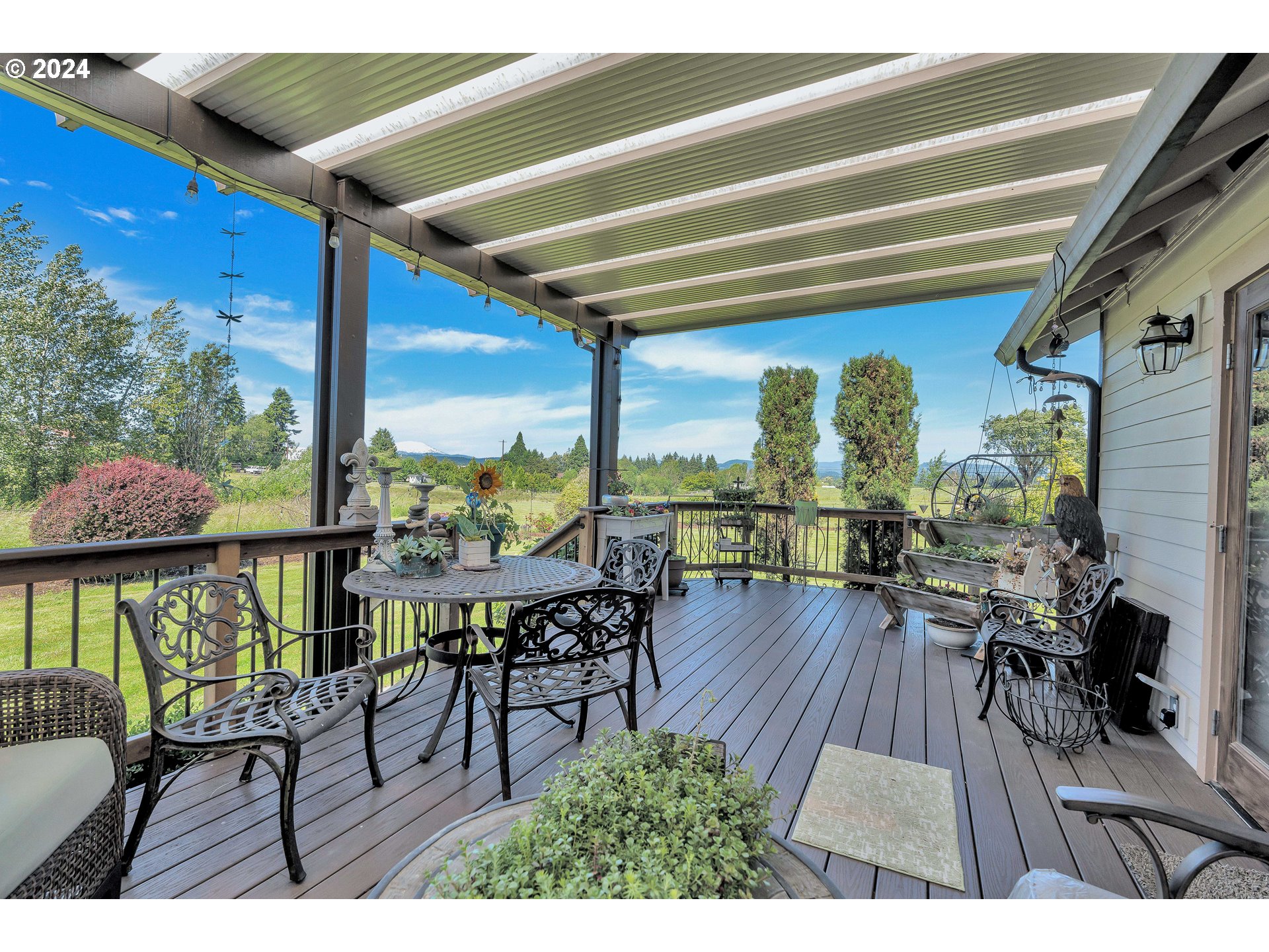 26400 Northeast 29th Avenue Ridgefield, WA 98642 - Photo 30 of 48 a view of a chairs and table in patio with wooden floor