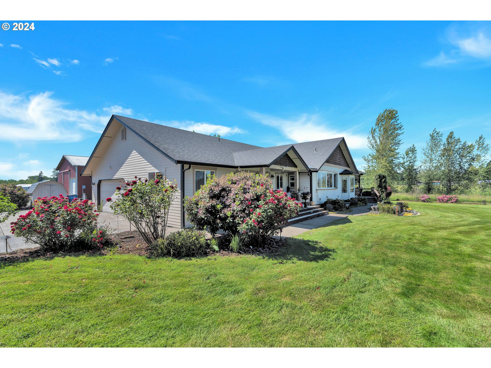 26400 Northeast 29th Avenue Ridgefield, WA 98642 - Photo 3 of 48 a front view of a house with garden