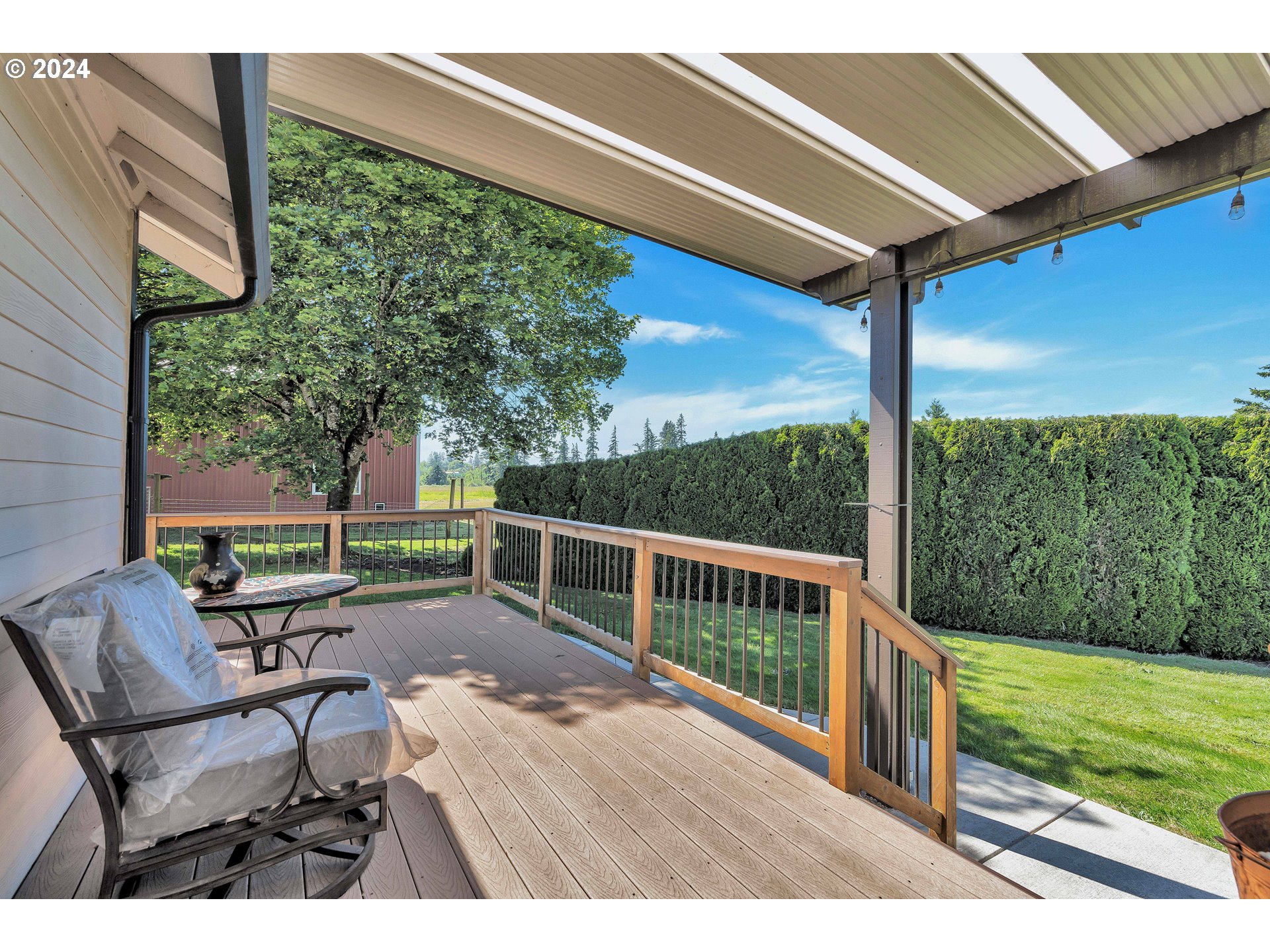 26400 Northeast 29th Avenue Ridgefield, WA 98642 - Photo 33 of 48 a view of a porch with furniture and backyard