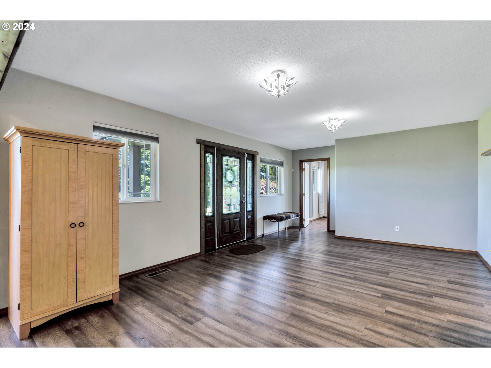 26400 Northeast 29th Avenue Ridgefield, WA 98642 - Photo 7 of 48 a view of an empty room with window and wooden floor