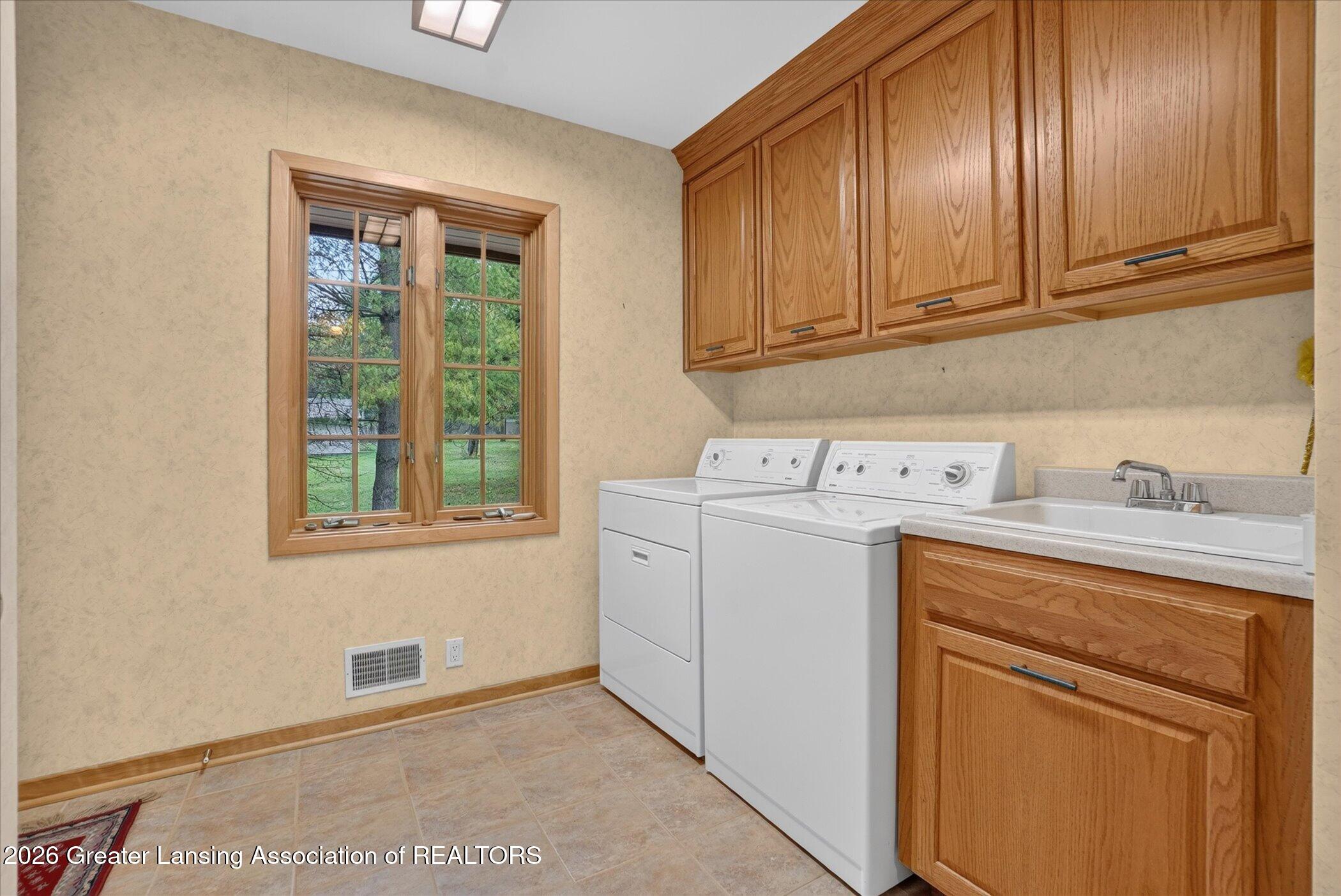 2310 Raby Road East Lansing, MI 48823 - Photo 38 of 48 2310 Raby Rd. Laundry main floor