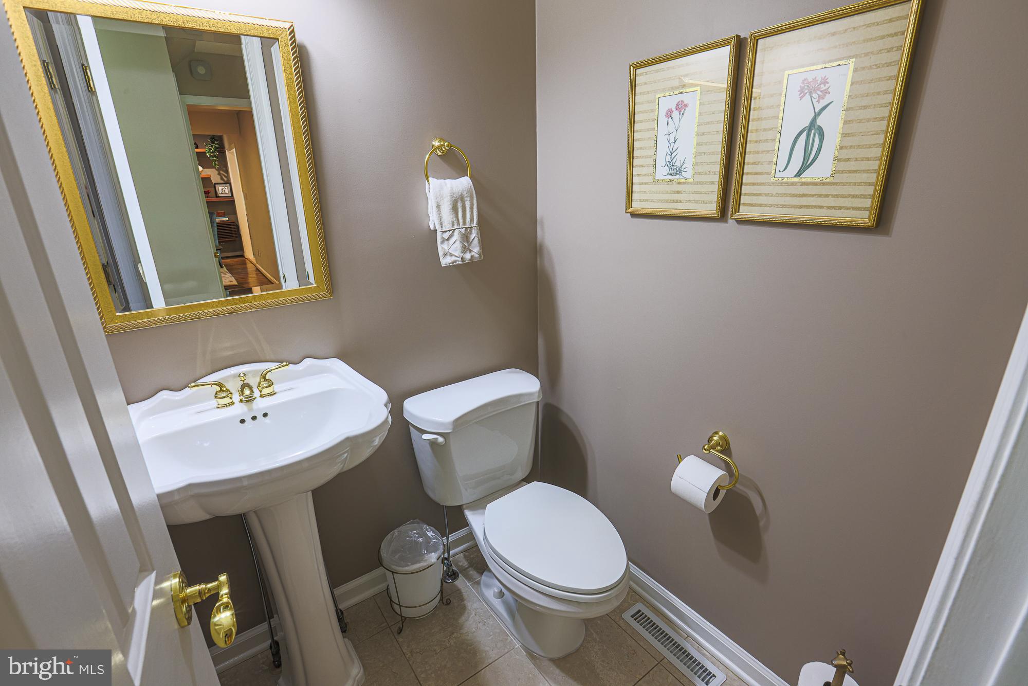 1516 Pinnacle Road Baltimore, MD 21286 - Photo 24 of 53 a white toilet sitting next to a bathroom sink
