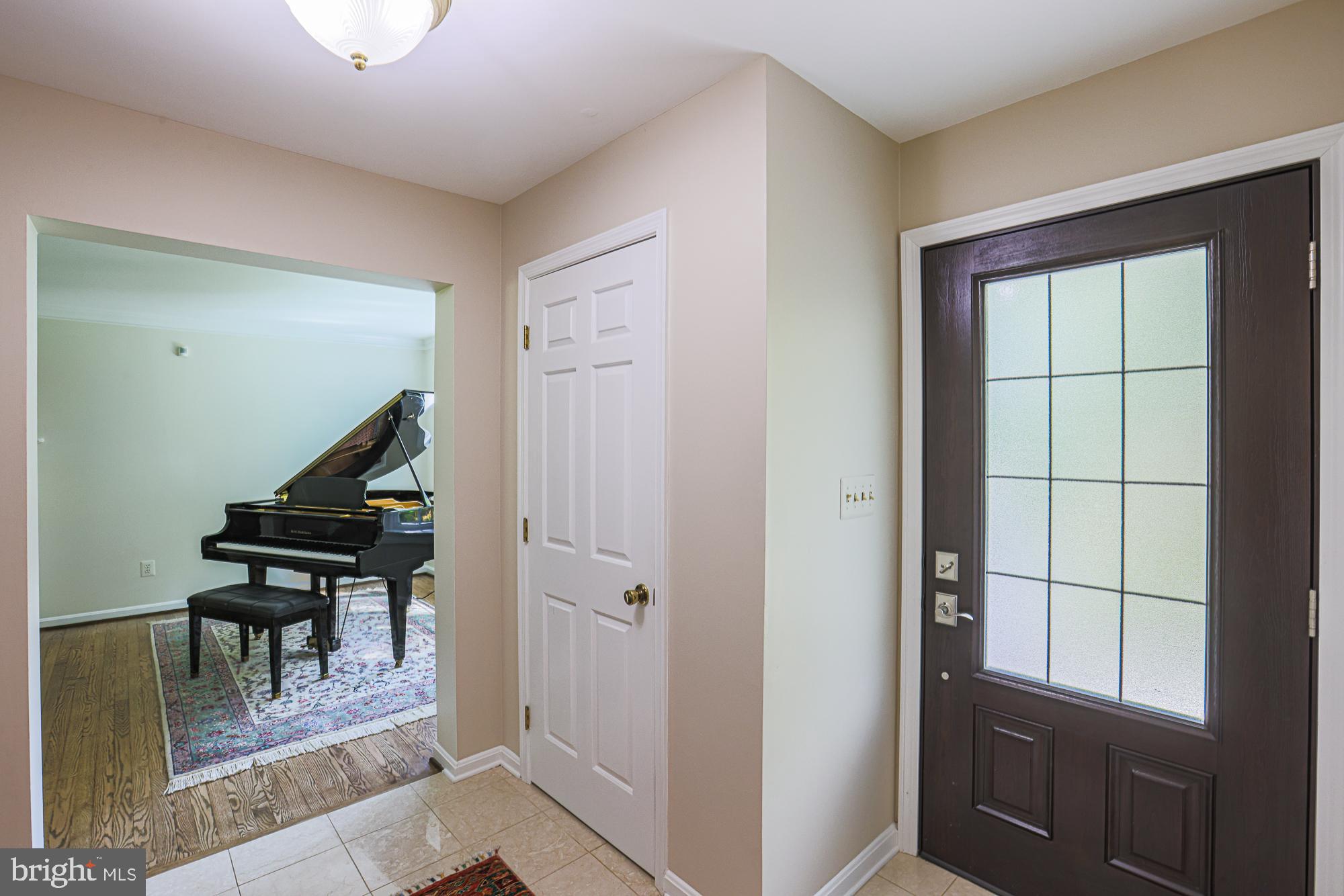 1516 Pinnacle Road Baltimore, MD 21286 - Photo 4 of 53 a view of entryway with stairs and wooden floor