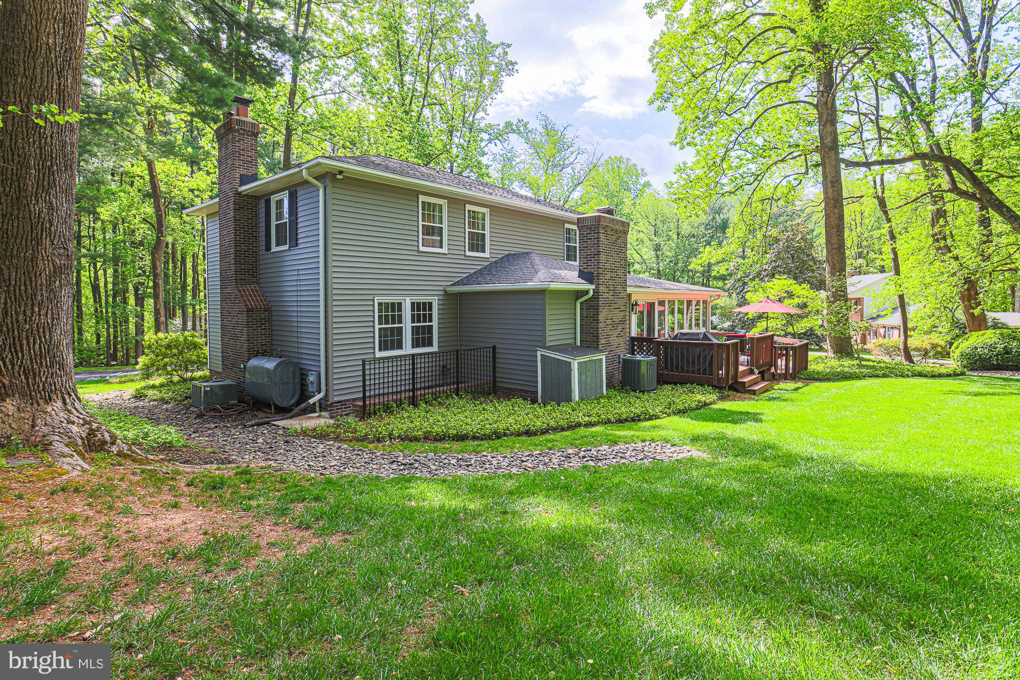 1516 Pinnacle Road Baltimore, MD 21286 - Photo 49 of 53 a view of a house with a yard and large trees