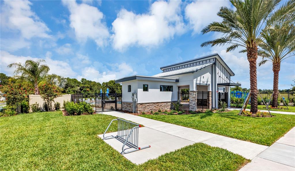 3046 Granite Rdg Avenue Minneola, FL 34715 - Photo 29 of 31 a front view of house with yard and green space