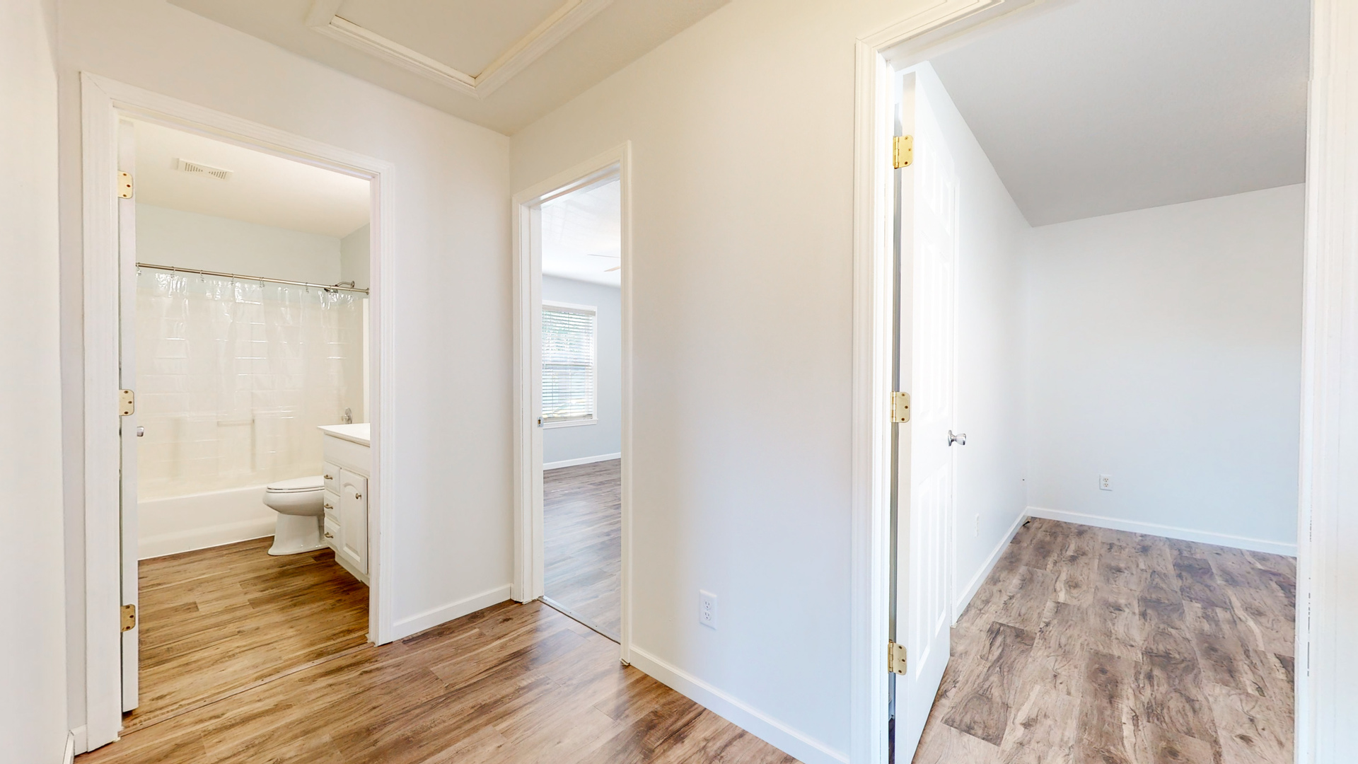 809 East 14th Street Georgetown, IL 61846 - Photo 8 of 52 a view of room with wooden floor and bathroom view
