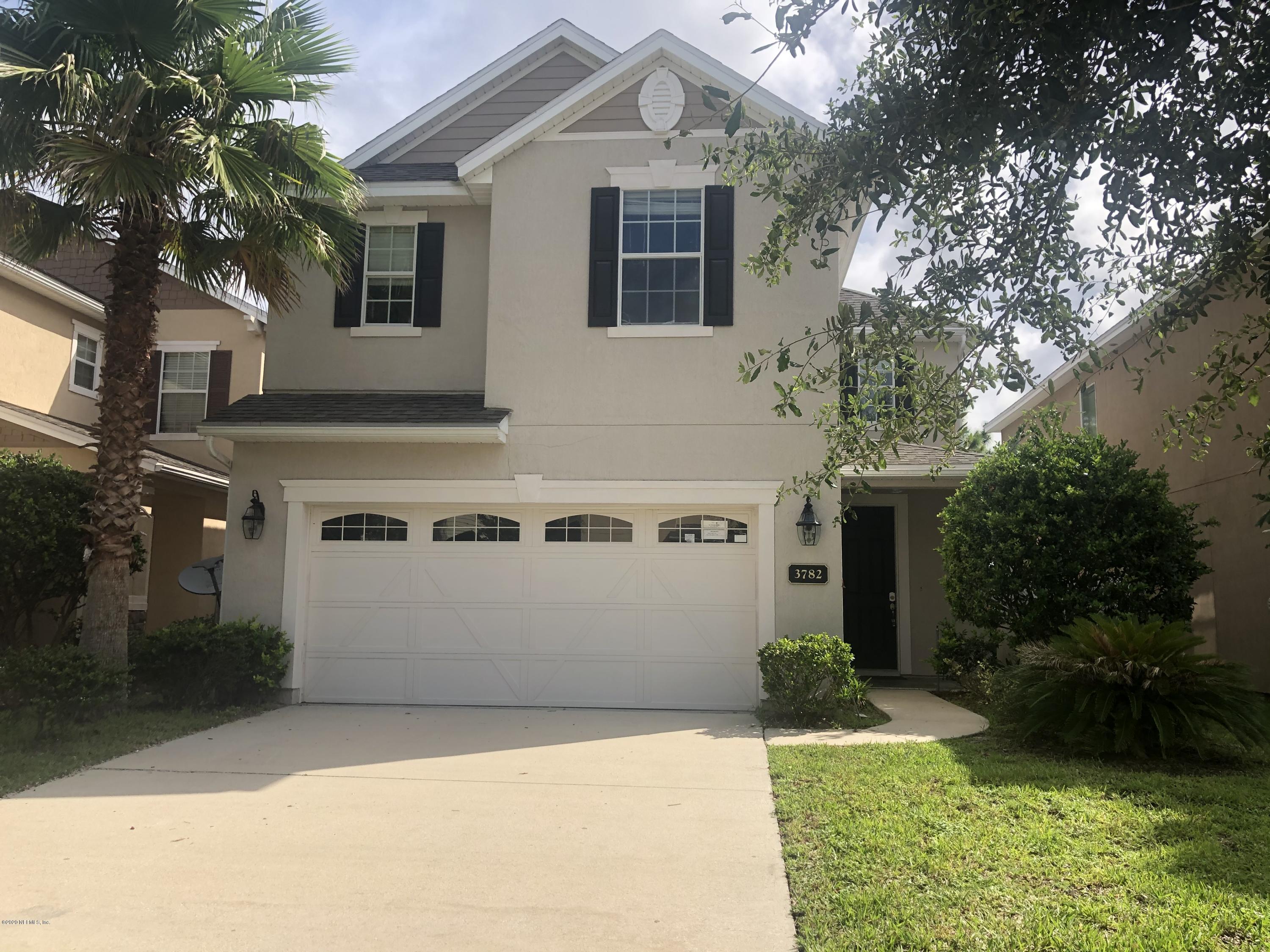 3782 Chasing Falls Road Orange Park, FL 32065 - Photo 1 of 22 a front view of a house with a yard and a garage