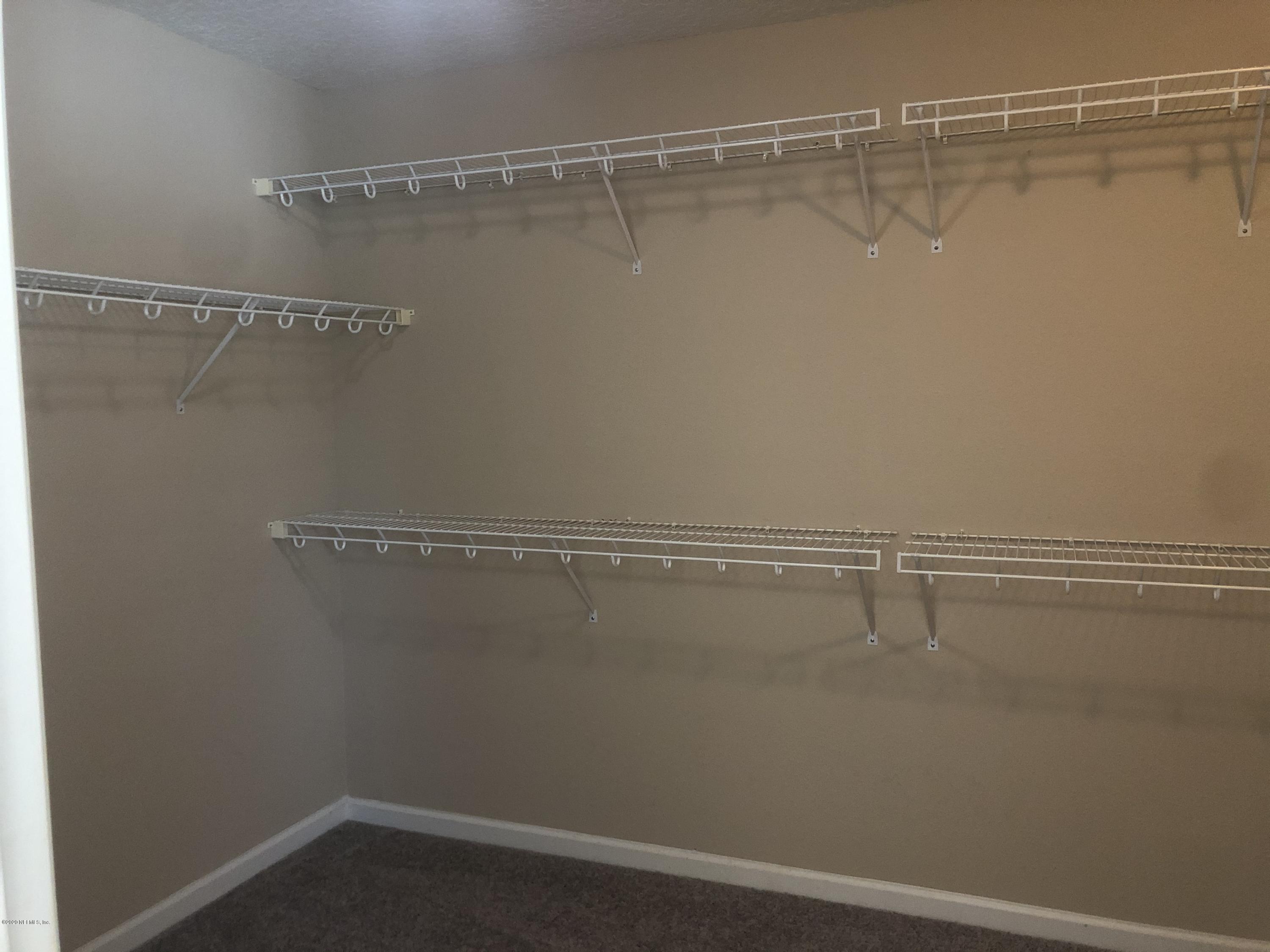 3782 Chasing Falls Road Orange Park, FL 32065 - Photo 15 of 22 a view of a room with racks on the wall
