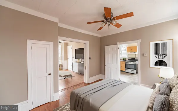 a bedroom with a bed and a chandelier