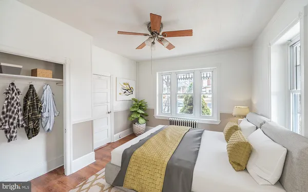 a spacious bedroom with a bed and a window