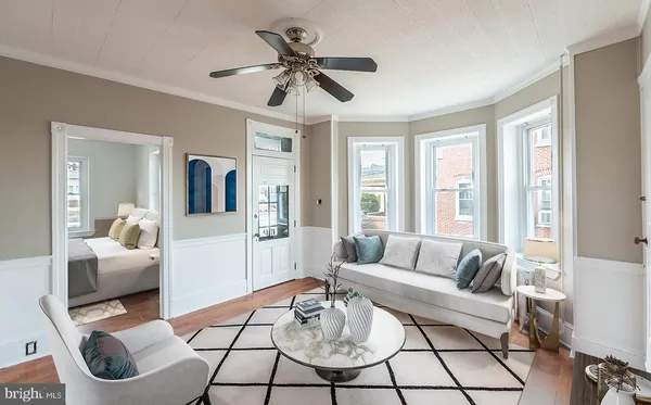 a living room with furniture and a large window